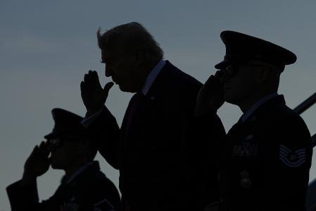 President Donald Trump salutes as he arrives on Air Force One at Charlottesville-Albemarle Airport, in Charlottesville, Va., Friday, April 10, 2026 (AP Photo/Matt Rourke)